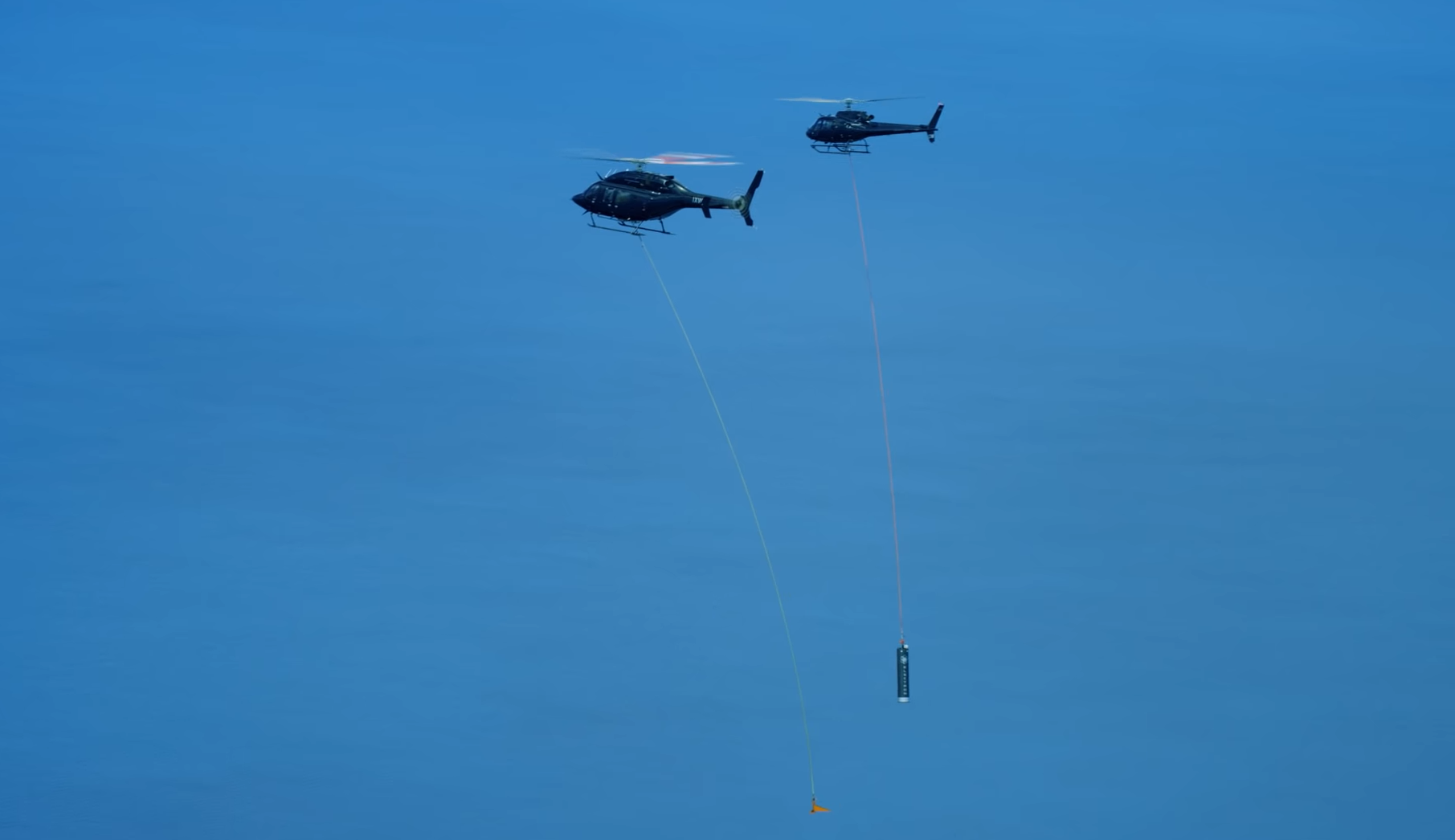 Helicopter ready to capture boosters and parachutes